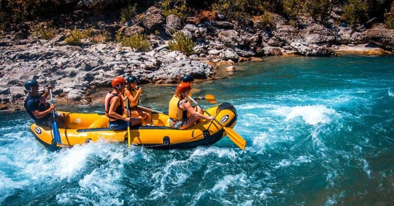 A group of people rafting in the Vjosa river Albania