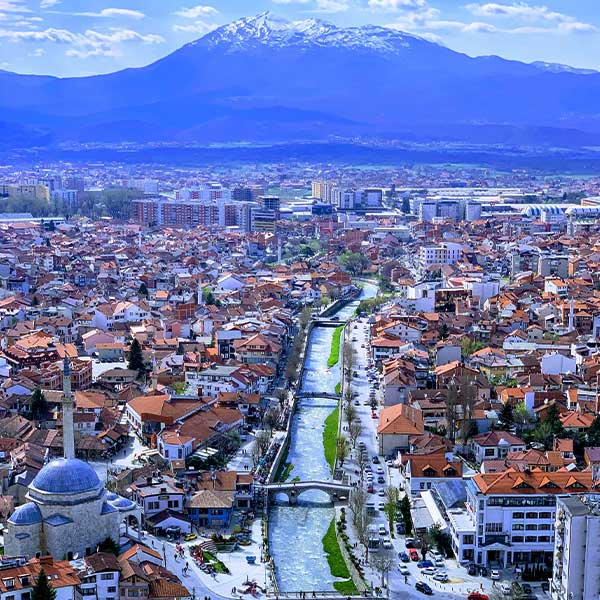 the city of Prizren, Kosovo, with its river and mountains in the background.