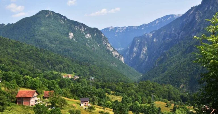 A photo of a valley with houses in the Boge Mountains of Kosovo.