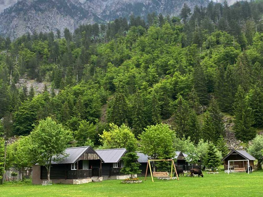 A photo of cottages in Valbona, Albania, nestled in the heart of the Albanian Alps.