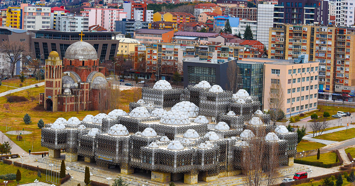 A close-up of the city of Pristina, Kosovo, showing the National Library of Kosovo.