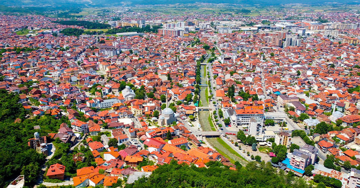 The city of Prizren, Kosovo, with its river and mountains in the background.