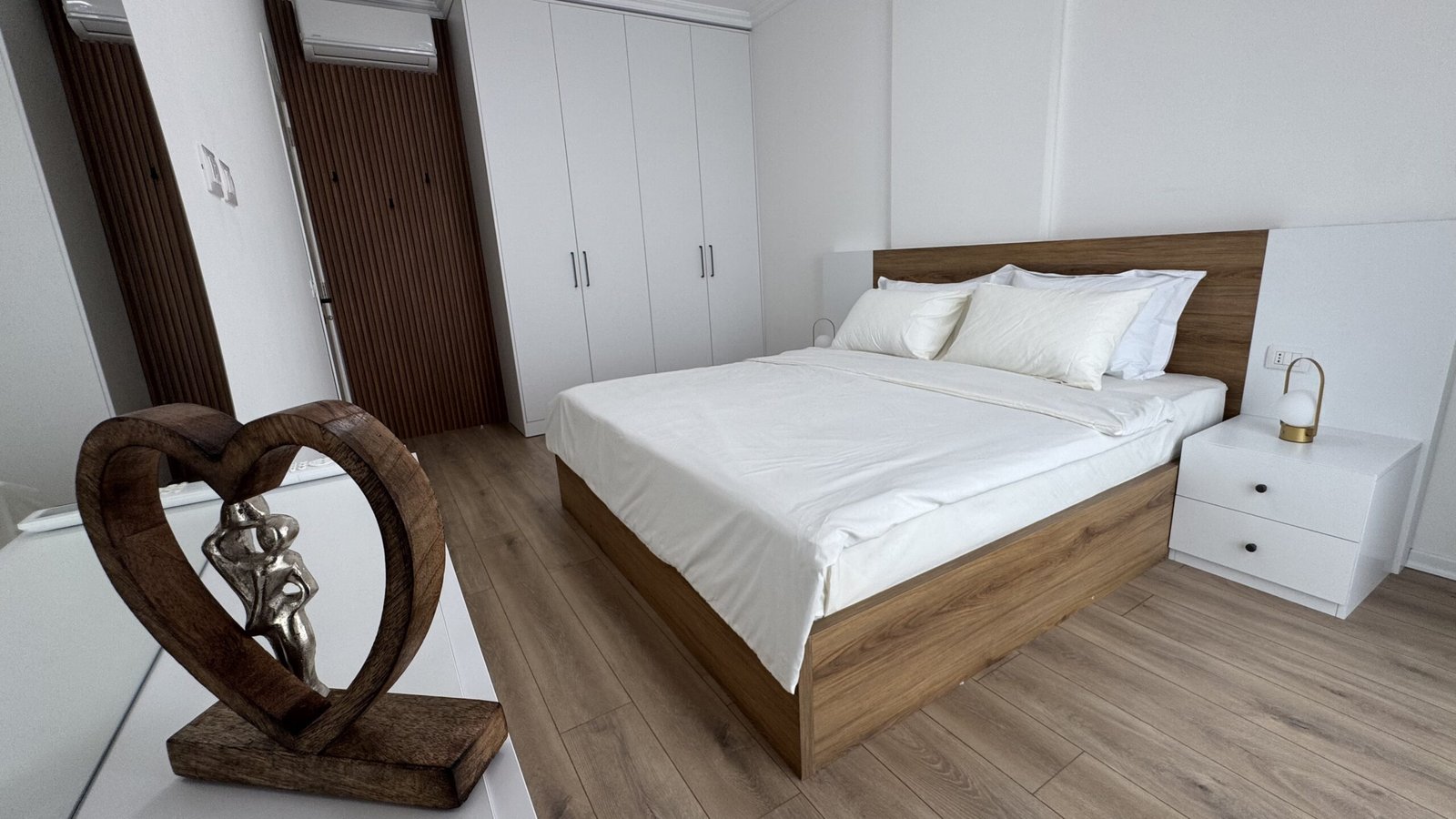 Master bedroom with king bed at Dubai Apartment in Tirana